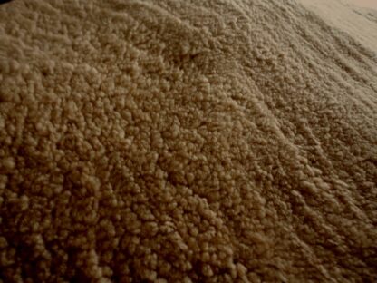 Honey Tan Brown Curly Sheep Hair On leather hide